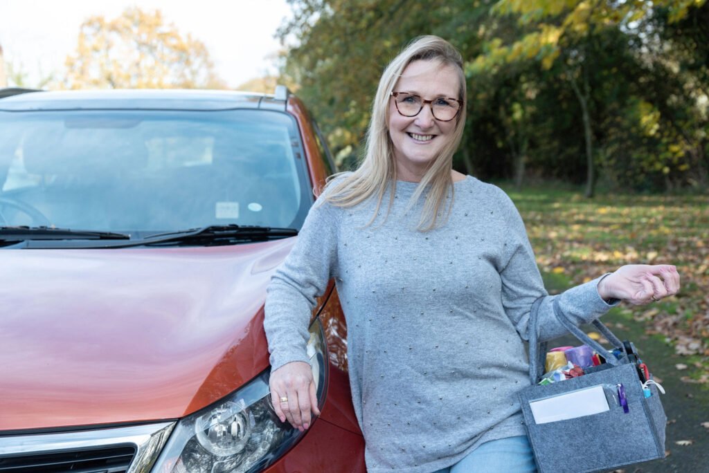 Rachel The declutter lady, stood by her car with declutter bag in hand ready to get Spring Clearing